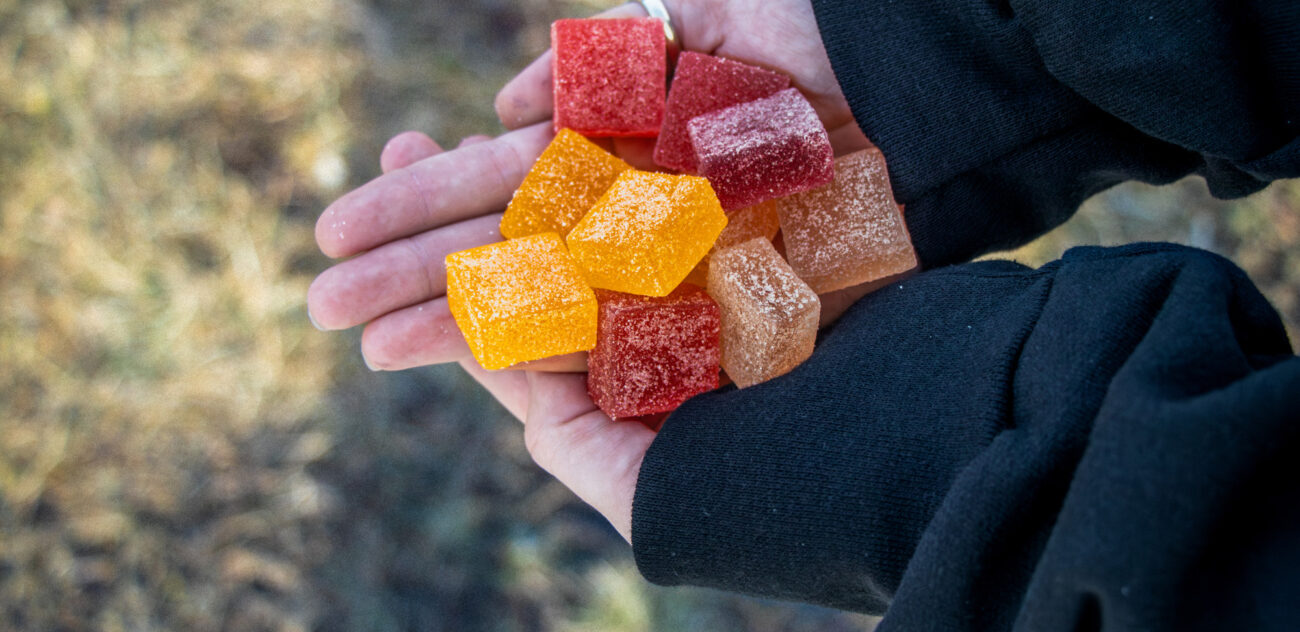 a handful of foundry gummies held with two hands